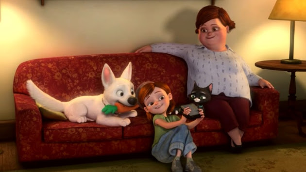 Bolt, Penny, Rhino, Mittens, and Penny' mom sit on a couch while Penny takes a photo